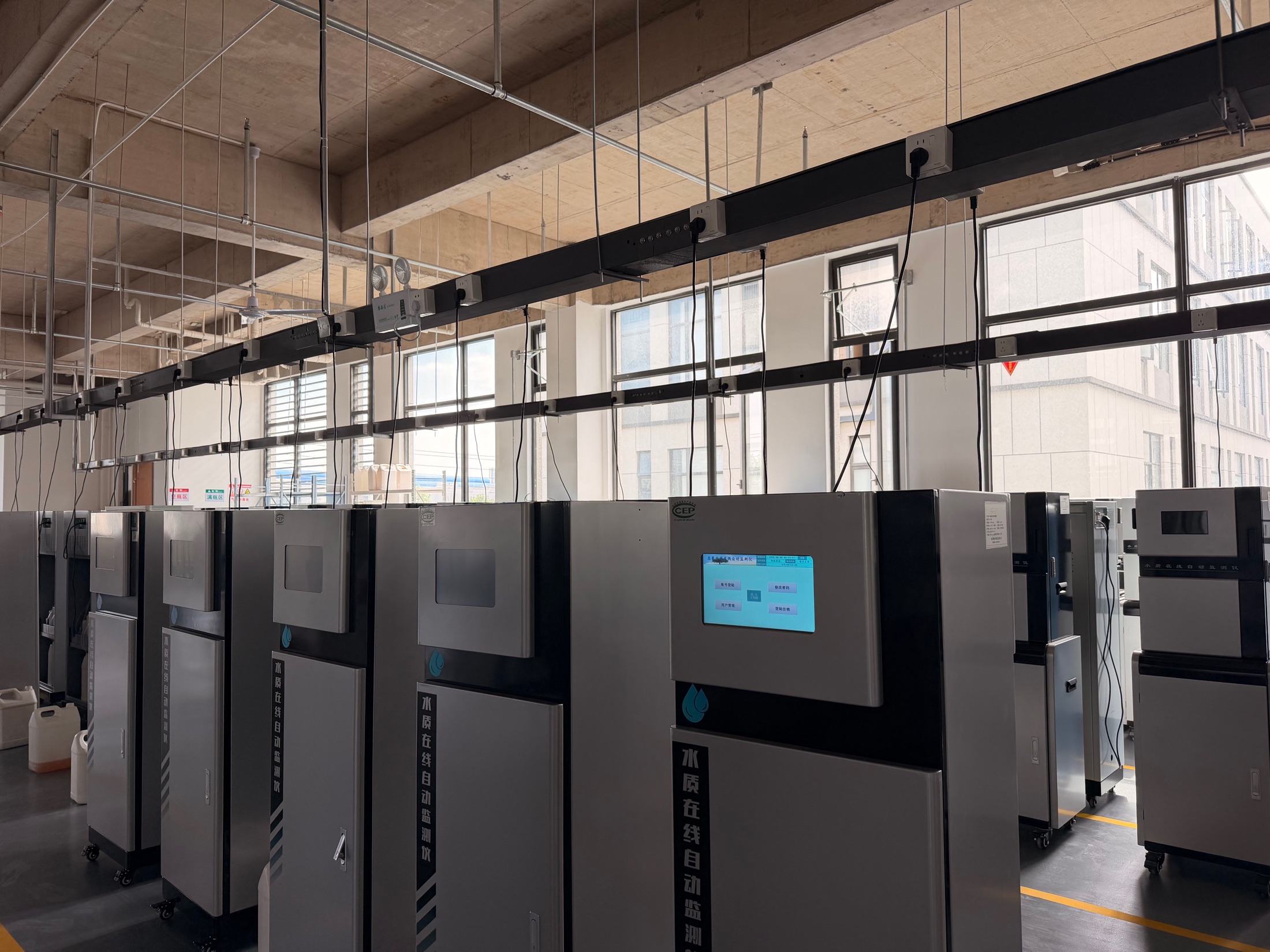 Factory workshop with online monitoring cabinet preparation and instrument assembly