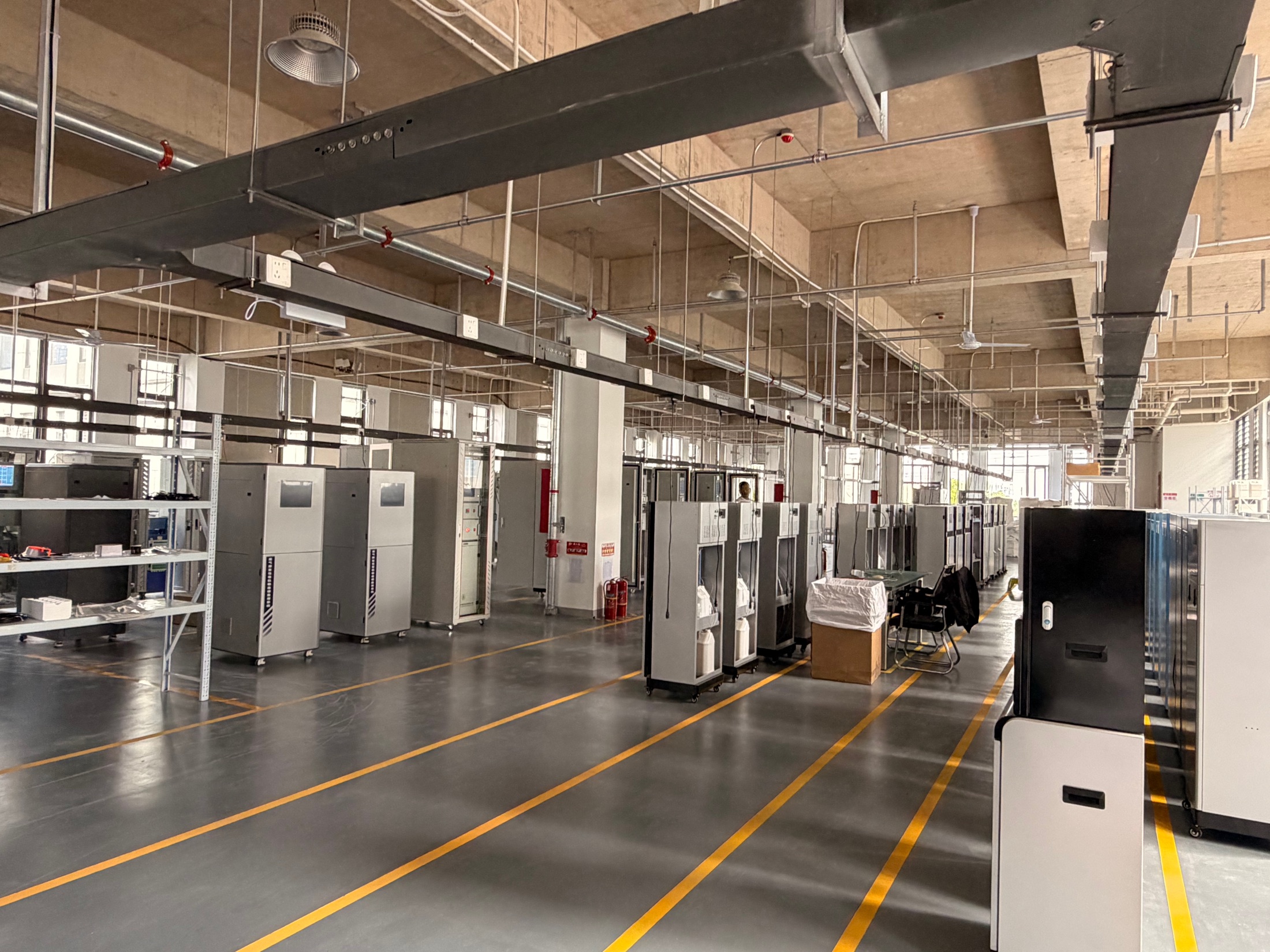 Instrument assembly area with online monitoring cabinets prepared for project delivery
